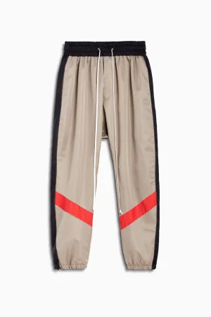 parachute track pant ii / wheat   black   red
